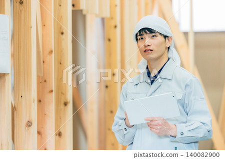 Male worker at a new construction site Male worker at a new construction site 140082900