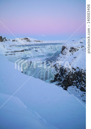 Gyao, the Earth's rift with a blue sky and snowy landscape - Iceland 140083406