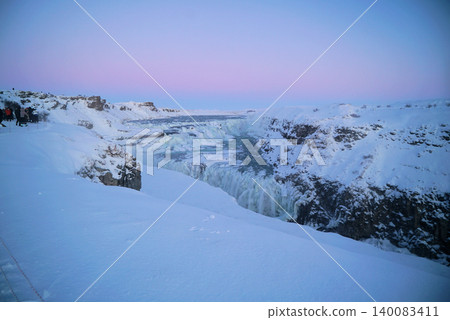 Gyao, the Earth's rift with a blue sky and snowy landscape - Iceland 140083411