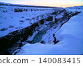 Gyao, the Earth's rift with a blue sky and snowy landscape - Iceland 140083415