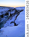 Gyao, the Earth's rift with a blue sky and snowy landscape - Iceland 140083416