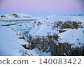 Gyao, the Earth's rift with a blue sky and snowy landscape - Iceland 140083422