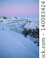 Gyao, the Earth's rift with a blue sky and snowy landscape - Iceland 140083424