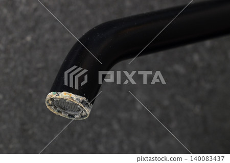 Limescale Buildup On Black Faucet Aerator 140083437