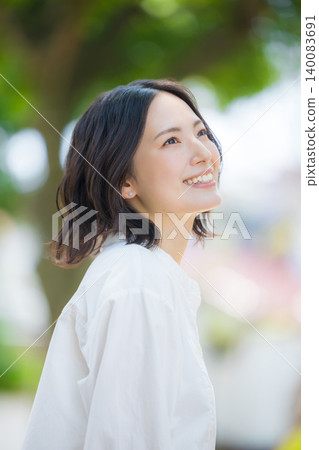 A woman walking in the fresh green 140083691