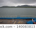 View from a Ferry Deck Crossing the Sea Towards a Misty Tropical Island Under an Overcast Sky in Krabi 140083813