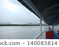 Covered Ferry Pier Walkway Overlooking Misty Mountains and Sea in Krabi 140083814