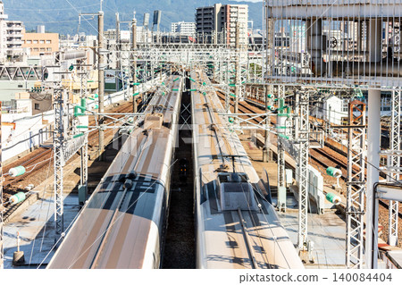 N700 series Shinkansen trains passing each other: An overhead view of Hiroshima Station's arrival and departure scene, including the roof structure. N700 series Shinkansen trains passing each other: An overhead view of Hiroshima Station's arrival and departure scene, including the roof structure. 140084404