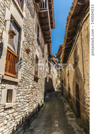 Narrow medieval stone alley in Rupit village, Catalonia, Spain, featuring traditional architecture Narrow medieval stone alley in Rupit village, Catalonia, Spain, featuring traditional architecture 140084833