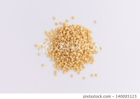 raw couscous isolated on white raw couscous isolated on white 140085123