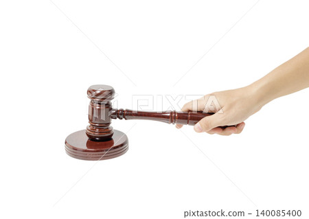 Hand holding a wooden judge's gavel. Justice and Law Concept. Legal, Agreement and Authority Symbol. High quality photo Hand holding a wooden judge's gavel. Justice and Law Concept. Legal, Agreement and Authority Symbol. High quality photo 140085400
