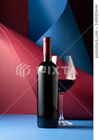 Bottle and glass of red wine. Bottle and glass of red wine. 140085644