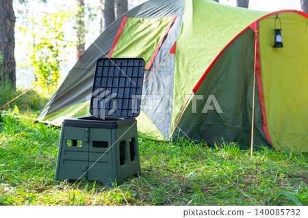 Portable toilet with tent on wild campsite, area use for travel hygiene and camping convenience, practical solution for nature tourism. Portable toilet with tent on wild campsite, area use for travel hygiene and camping convenience, practical solution for nature tourism. 140085732