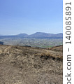 The tranquil rural landscape of the Aso caldera spreads out below. 140085891