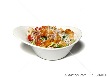 Healthy mixed salad in white bowl on wooden table. Mediterranean salad 140086061