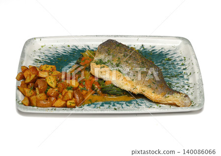 Sea bass fish , potatoes and salad in a plate on a white isolated background Sea bass fish , potatoes and salad in a plate on a white isolated background 140086066