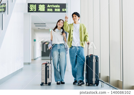 A couple arriving at their travel destination airport. (Photo courtesy of Kobe Airport (UKB)) A couple arriving at their travel destination airport. (Photo courtesy of Kobe Airport (UKB)) 140086102