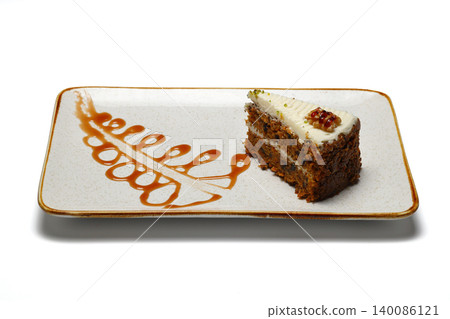 piece of cake on a plate. isolated on white background. piece of cake on a plate. isolated on white background. 140086121