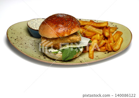 Tasty chicken burger with french fries isolated on white background. 140086122
