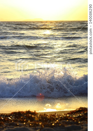 Wave splash at sunset close up. Ocean water in sunlight in motion. Abstract sea background Wave splash at sunset close up. Ocean water in sunlight in motion. Abstract sea background 140086290