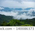 Misty panoramic landscape of Shodoshima Island with Seto Inland Sea, mountain ridges and drifting clouds. 140086373