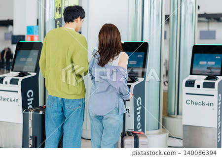 A couple using self-check-in at the airport. (Photo courtesy of Kobe Airport (UKB)) A couple using self-check-in at the airport. (Photo courtesy of Kobe Airport (UKB)) 140086394