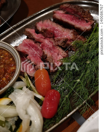 Grilled Beef Slices on Metal Tray with Dill and Cherry Tomatoes 140086767