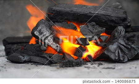 Burning Charcoal Emitting Intense Heat and Glowing Embers 140086875