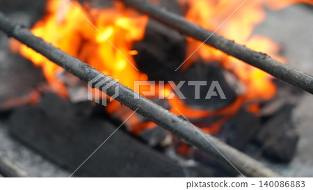 Fiery Charcoal Grill Blazing Hot Coals Under Metal Rods Fiery Charcoal Grill Blazing Hot Coals Under Metal Rods 140086883