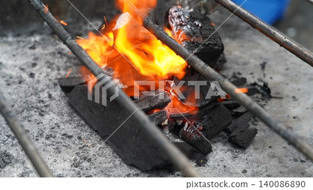 Fiery Charcoal Embers Heating Up for a Delicious BBQ Fiery Charcoal Embers Heating Up for a Delicious BBQ 140086890