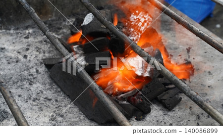 Close-up of Fiery Hot Charcoal Ready for Barbecue Grilling Close-up of Fiery Hot Charcoal Ready for Barbecue Grilling 140086899