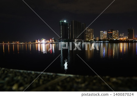 City Skyline at Night Reflecting in the Water City Skyline at Night Reflecting in the Water 140087024