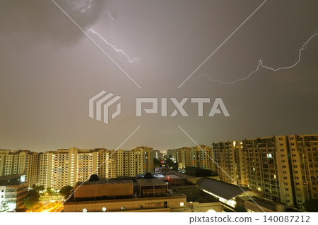 Cityscape Lightning Storm Striking Over Residential Buildings 140087212