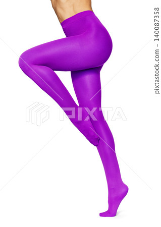 Woman wearing vibrant purple tights on white background Woman wearing vibrant purple tights on white background 140087358