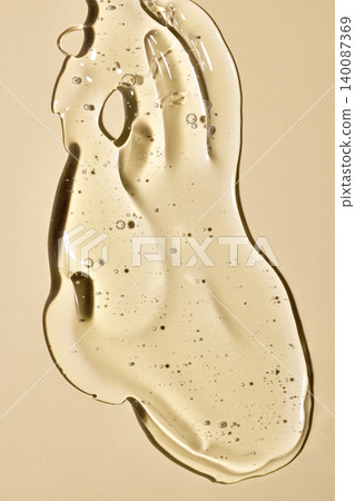 Liquid gold serum texture with bubbles Liquid gold serum texture with bubbles 140087369
