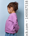 Child enjoying audio entertainment using modern wireless earphones 140087538