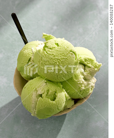 bowl of green matcha ice cream scoops bowl of green matcha ice cream scoops 140088287