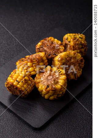 Corn chunks grilled or barbecued with salt and spices. Grilled corn Corn chunks grilled or barbecued with salt and spices. Grilled corn 140088715