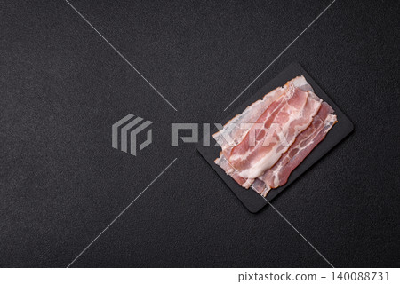 Raw fresh bacon slices with layers of meat or prosciutto with salt and spices. Raw bacon 140088731