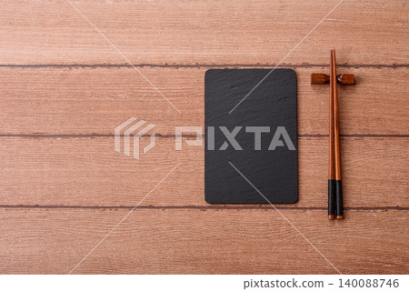 An empty slate cutting board for preparing ingredients for home cooking. An empty cutting board 140088746