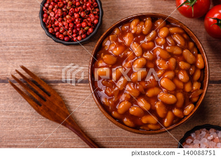 Beans in tomato sauce, a canned stew for the dinner table. Beans in tomato sauce 140088751