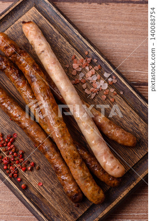 Thin chicken or pork sausages grilled or barbecued. Grilled sausages Thin chicken or pork sausages grilled or barbecued. Grilled sausages 140088754