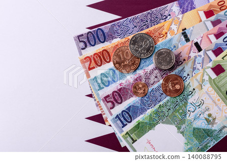 Qatar paper money, the Qatari riyal as a tool for financial transactions and trade. Qatari money Qatar paper money, the Qatari riyal as a tool for financial transactions and trade. Qatari money 140088795