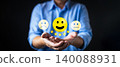 Businessman hands holding yellow happy smile face icon with five star rating. Concept of customer satisfaction survey, excellent service feedback, and positive business review experience. 140088931