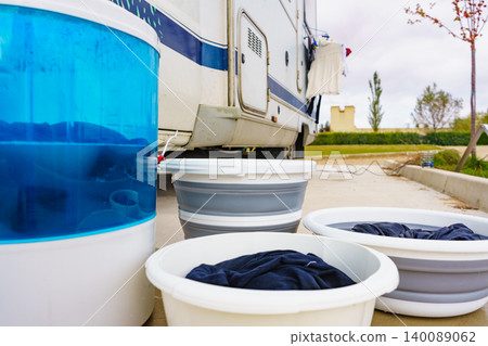 Washing laundry outdoor at caravan Washing laundry outdoor at caravan 140089062