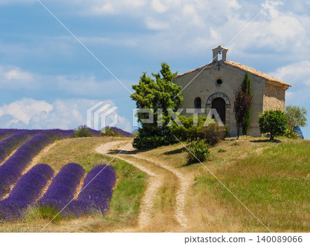 Lavender field and chapel at Entrevennes village, France Lavender field and chapel at Entrevennes village, France 140089066