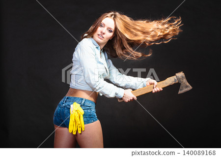 Sexy strong woman feminist with axe working. 140089168