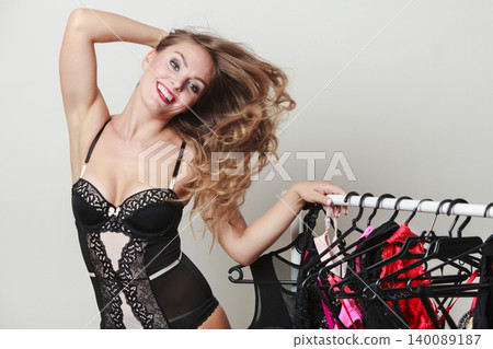 Expressive sexy lady with collection of lingerie. Expressive sexy lady with collection of lingerie. 140089187