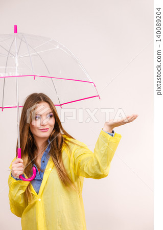 Woman in rainproof coat with umbrella. Forecasting Woman in rainproof coat with umbrella. Forecasting 140089204