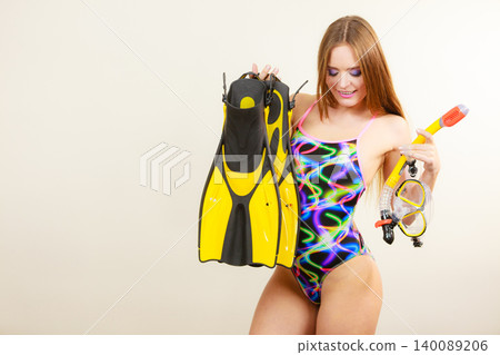 Woman with flippers and snorkeling mask having fun Woman with flippers and snorkeling mask having fun 140089206